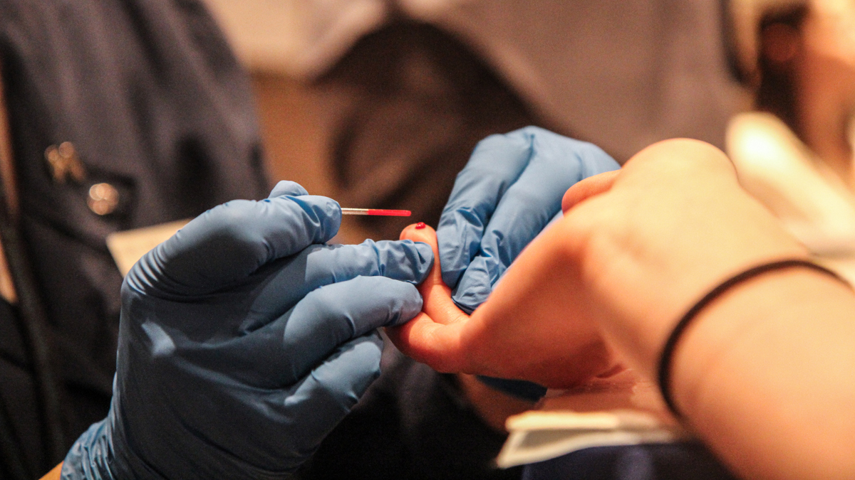 Blood is drawn for lead testing at a health fair in a county affected by Hurricane Sandy. (Kimberly Paynter/WHYY)