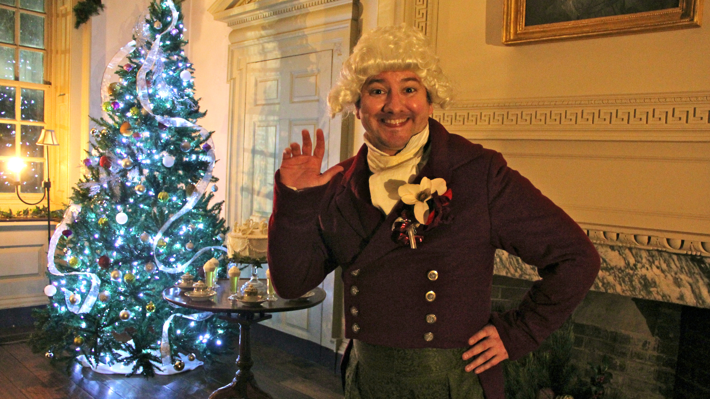 Mr. Fezziwig greets visitors to Mt. Pleasant during A Fairmount Christmas Carol trolley tour. (Emma Lee/WHYY)