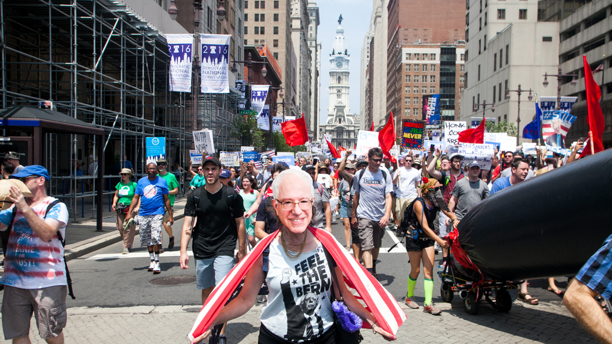 Bernie Sanders supporters march down South Broad Street for the second day in a row Monday. (Brad Larrison for NewsWorks)