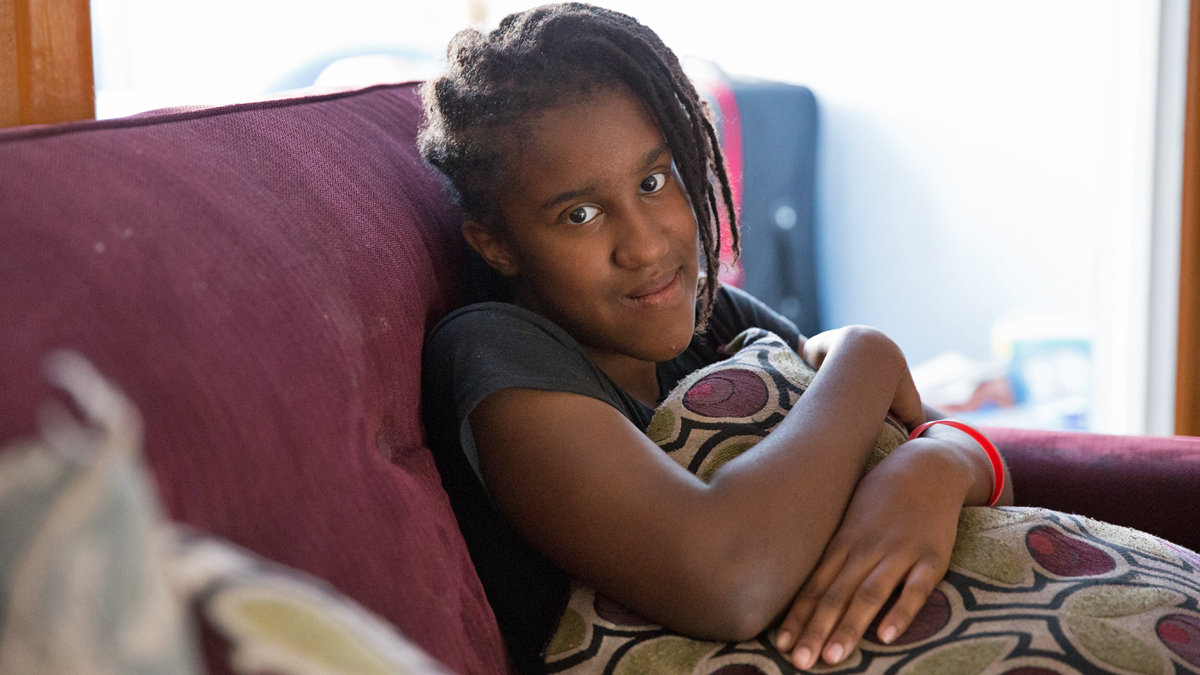  Christina Lee, a 7th grader at Feltonville School of Arts and Science, dreams of becoming a fashion designer and likes to design tattoos in her sketch book. Lee's mother says the school is not meeting her daughter's IEP. (Lindsay Lazarski/WHYY) 