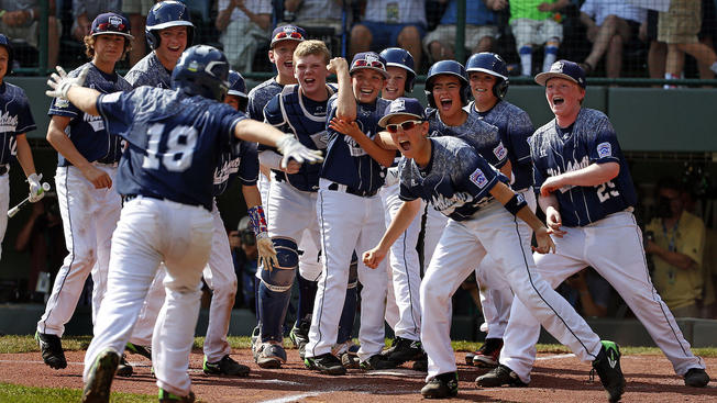  Lewisberry, Pa.'s Dylan Rodenhaber (18) runs home to a celebration with teammates after hitting a grand slam off Japan's Masafuji Nishijima in the first inning of the Little League World Series Championship baseball game in South Williamsport, Pa., Sunday, Aug. 30, 2015. (AP Photo/Gene J. Puskar) 