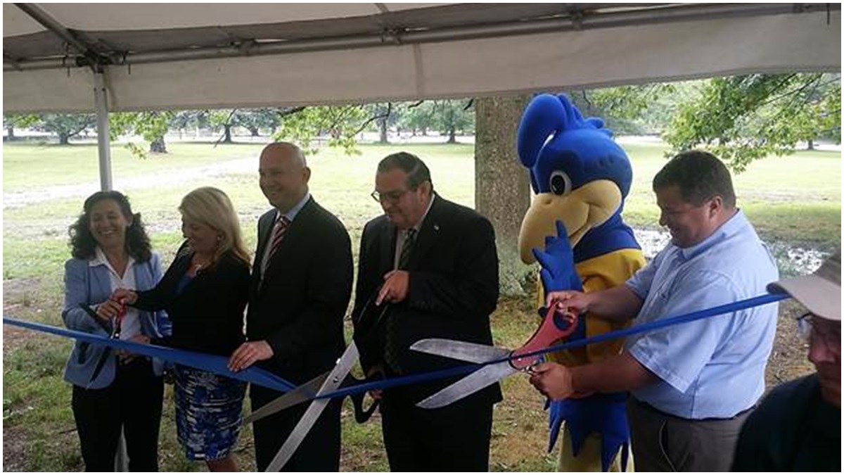 Elected leaders & key stakeholders celebrate the official reopening of Lums Pond State Park campground (DNREC photo)