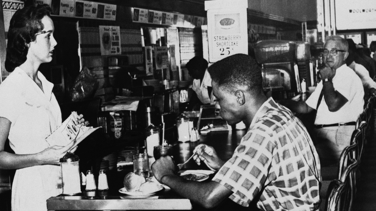  A Black man desegregates a lunch counter in Tampa on Sept. 14, 1960.  (AP Photo) 