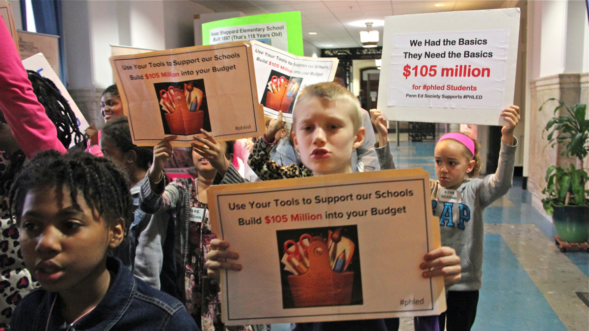  Tony Soto of Philadelphia and other participants in the 250-mile March2Justice Walk join with a Philadelphia group demanding a $15 minimum wage. (Emma Lee/WHYY) 