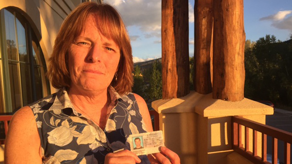 Aspen resident Kim Baillargeon holding her son Raymond Vieira's driver's license. He committed suicide in 2014. (Marci Krivonen/for The Pulse)