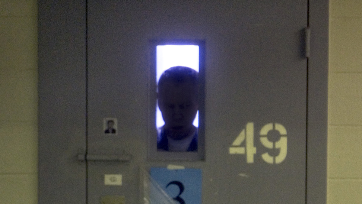  A mentally ill man is silhouetted by his cell's window inside a maximum-security prison in Idaho, where he was sent for treatment because there is no where else for him to go. (AP Photo/Troy Maben, file) 