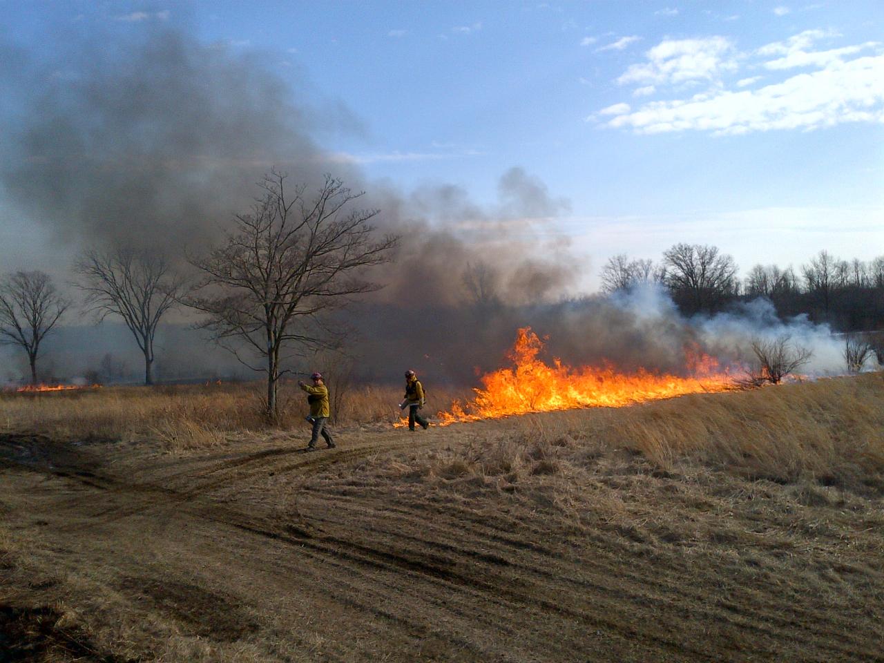 District wardens Kevin Morrissey, left, and Mike Moran, right, working during a prescribed burn at Monmouth Battlefield State Park on March 8, 2014. (Courtesy of Pete Monaco, NJFFS)