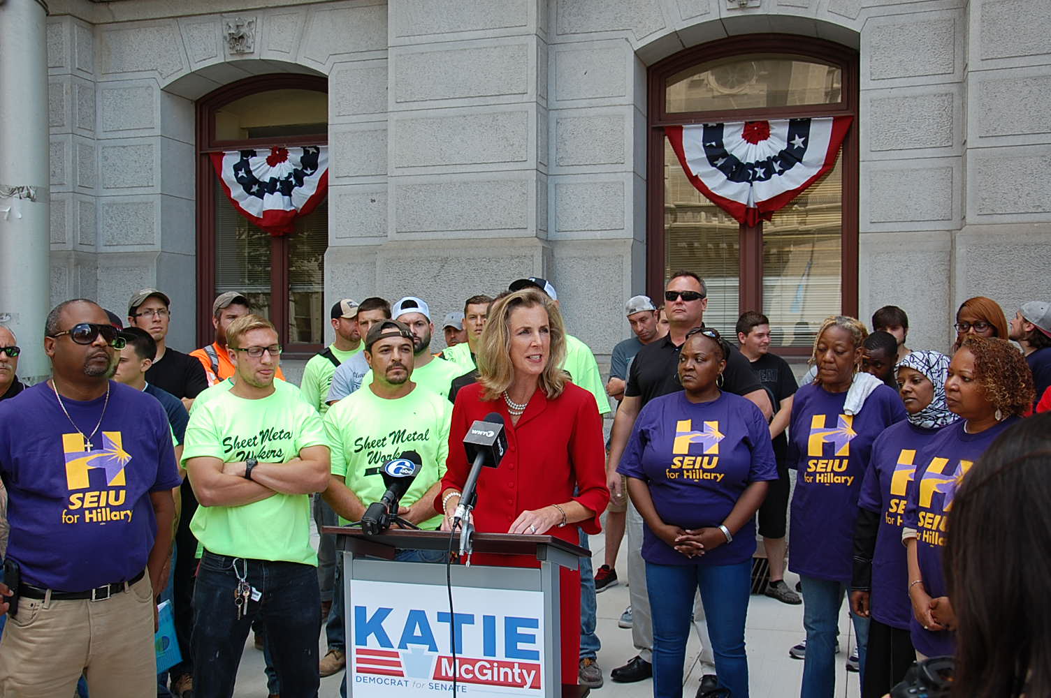 Katie McGinty talks trade with union members outside City Hall (Tom MacDonald Newsworks)