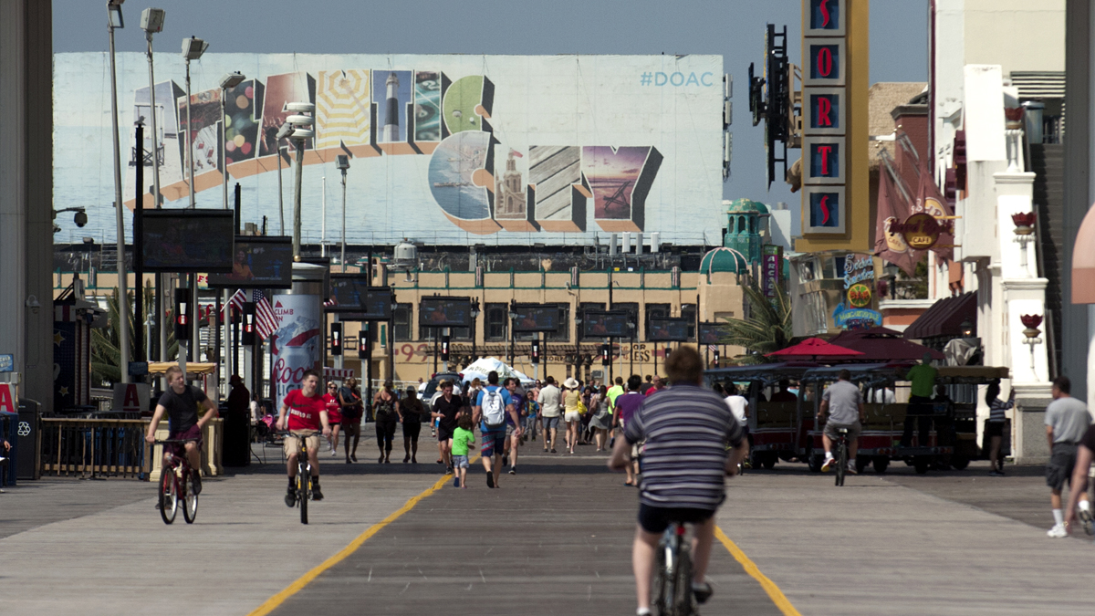 People ride bikes and walk the Atlantic City boardwalk Memorial Day weekend. Saturday, May 28 2016.  (Anthony Smedile for NewsWorks)