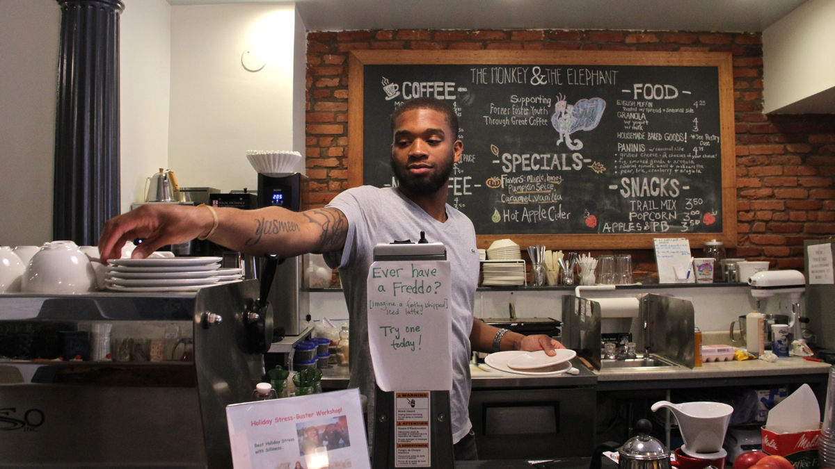  Naje Taylor works as a barista at The Monkey & The Elephant cafe in Brewerytown. (Emma Lee/WHYY) 