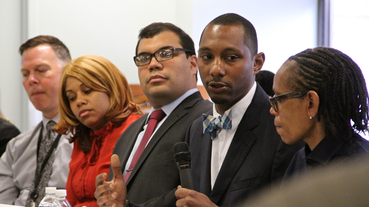 Attorney Michael Lee speaks in favor of expungement at a roundtable discussion on the challenges faced by ex-prisoners. He is a lead attorney in a suit that alleges SEPTA denied a man a job because of a prior criminal conviction. (Emma Lee/WHYY)