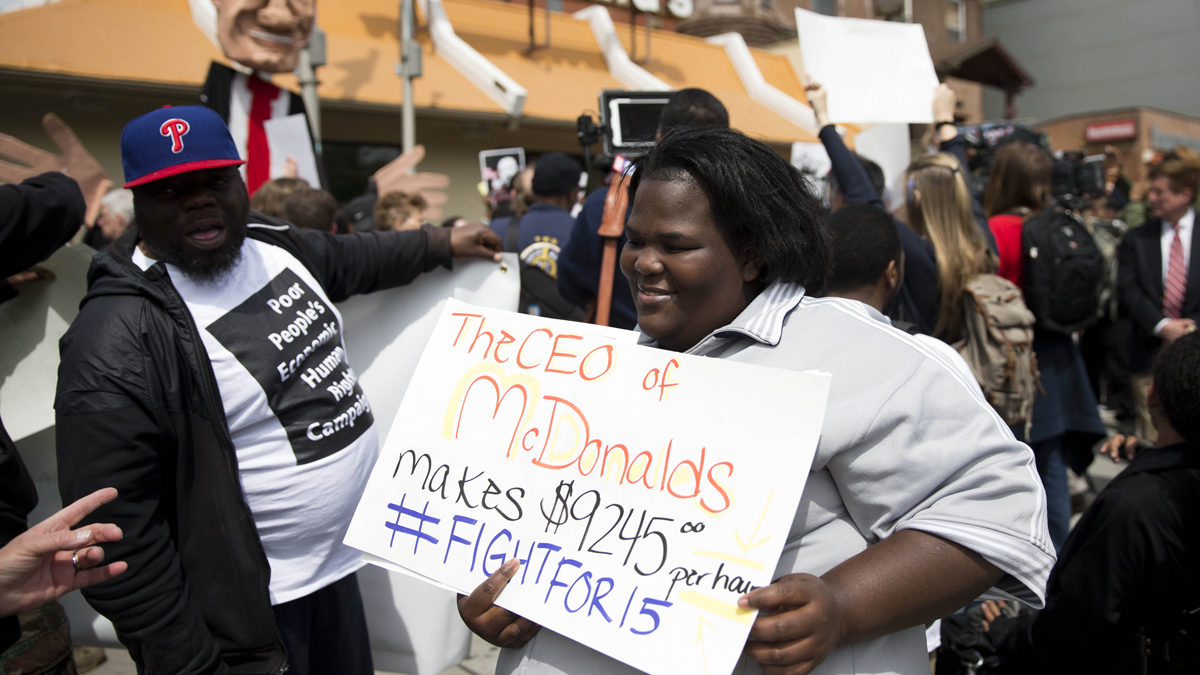  Fast food worker Lateefa Davis gathers with others for a May Day demonstration calling for a raise of the minimum wages to $15 an hour Friday, May 1, 2015, at a McDonald's restaurant in Philadelphia, Pa. (AP Photo/Matt Rourke) 