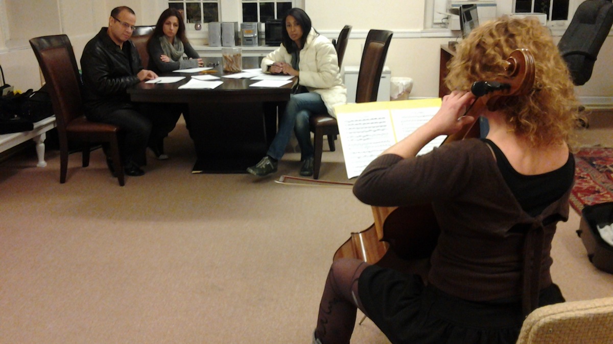  Music Director Jeri Lynne Johnson, in white, listens to Marthelène Gabon. (Alaina Mabaso/for NewsWorks) 