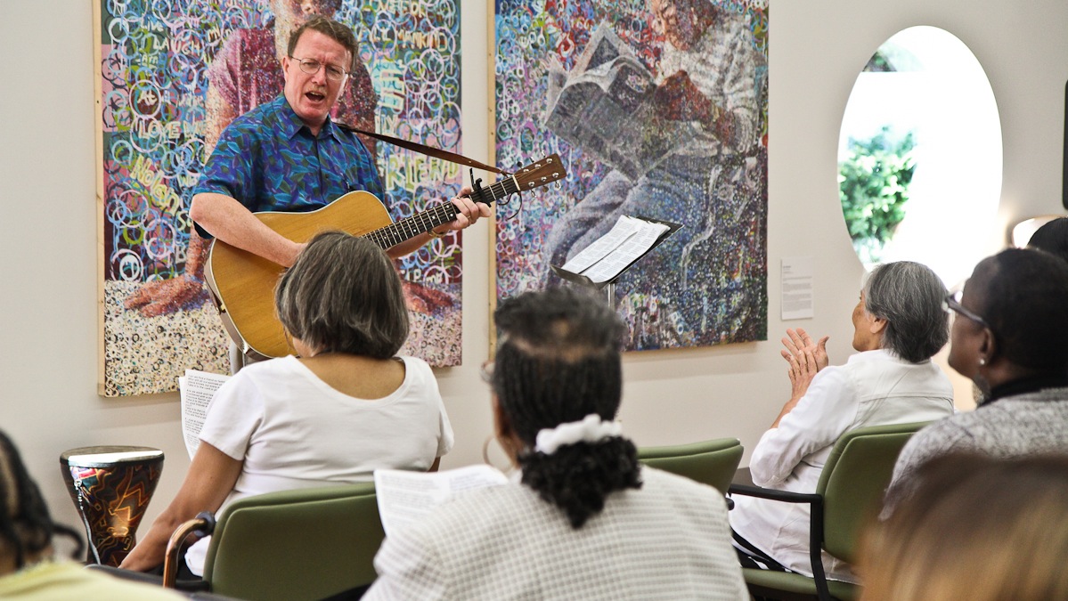 Jerry O'Leary leads a musc therapy class in a song at NewCourtland LIFE in North Philadelphia. (Kimberly Paynter/WHYY)
