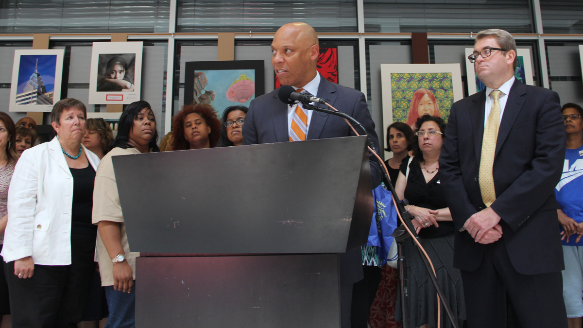  School Reform Commission members Bill Green (right) and Marjorie Neff (left) join Superintendent William Hite during a 2014 press conference at the School Administration Building. (NewsWorks file photo) 
