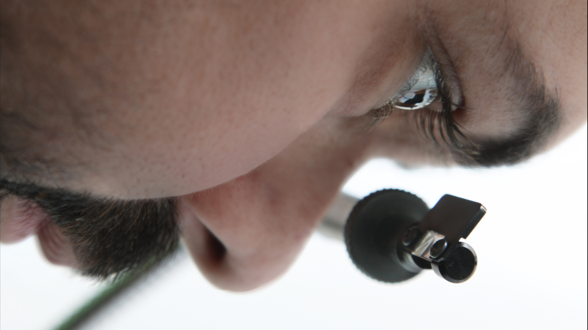  With a blank piece of paper on the table below, the user looks straight down at the prism's exposed edge. (Image courtesy of Pablo Garcia and Golan Levin) 