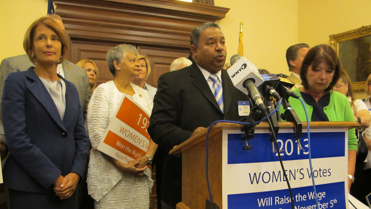  At a N.J. Statehouse news conference, supporters including Democratic gubernatorial candidate state Sen. Barbara Buono, left, urge voter approval of a constitutional amendment to increase New Jersey's minimum wage. (Phil Gregory/for NewsWorks) 