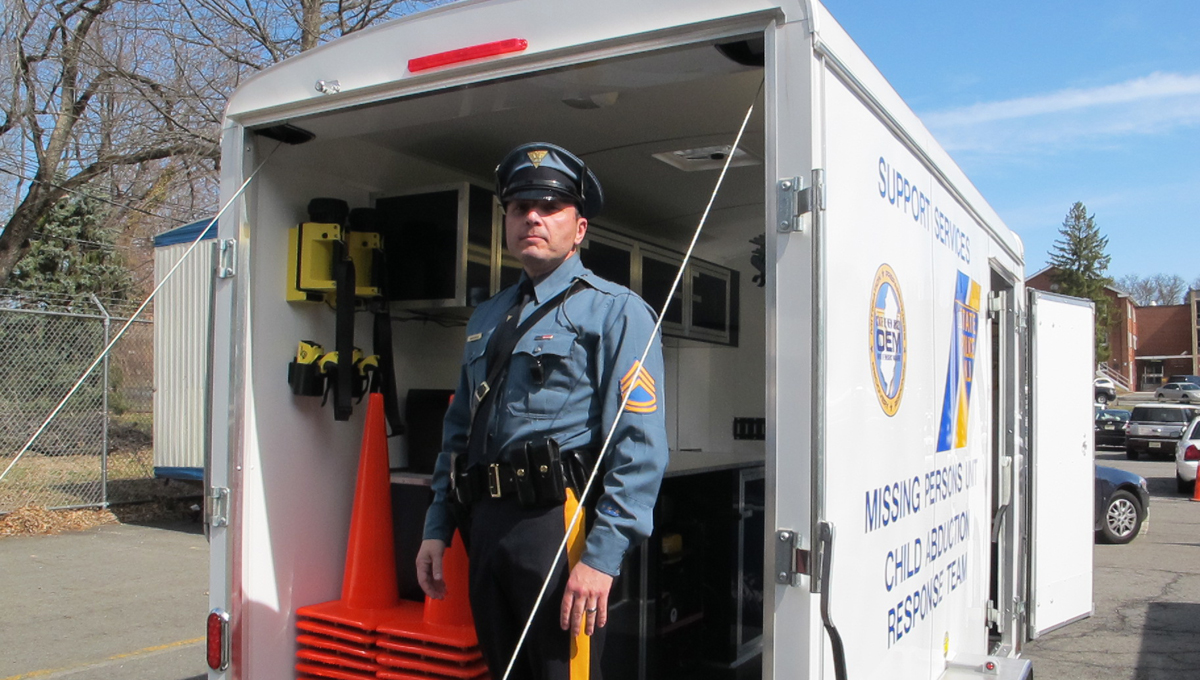  Lieutenant Louis Andrinopoulos, the head of the N.J. State Police Missing Persons Unit, displays the new trailer that was purchased with federal grant money. (Phil Gregory/for NewsWorks) 