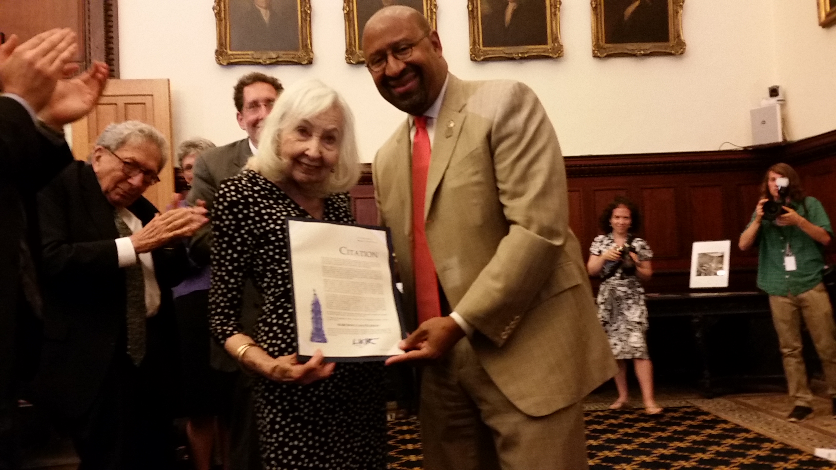  Marciene Mattleman and Mayor Michael Nutter display the city proclamation in her honor Wednesday. (Tom MacDonald/WHYY)  