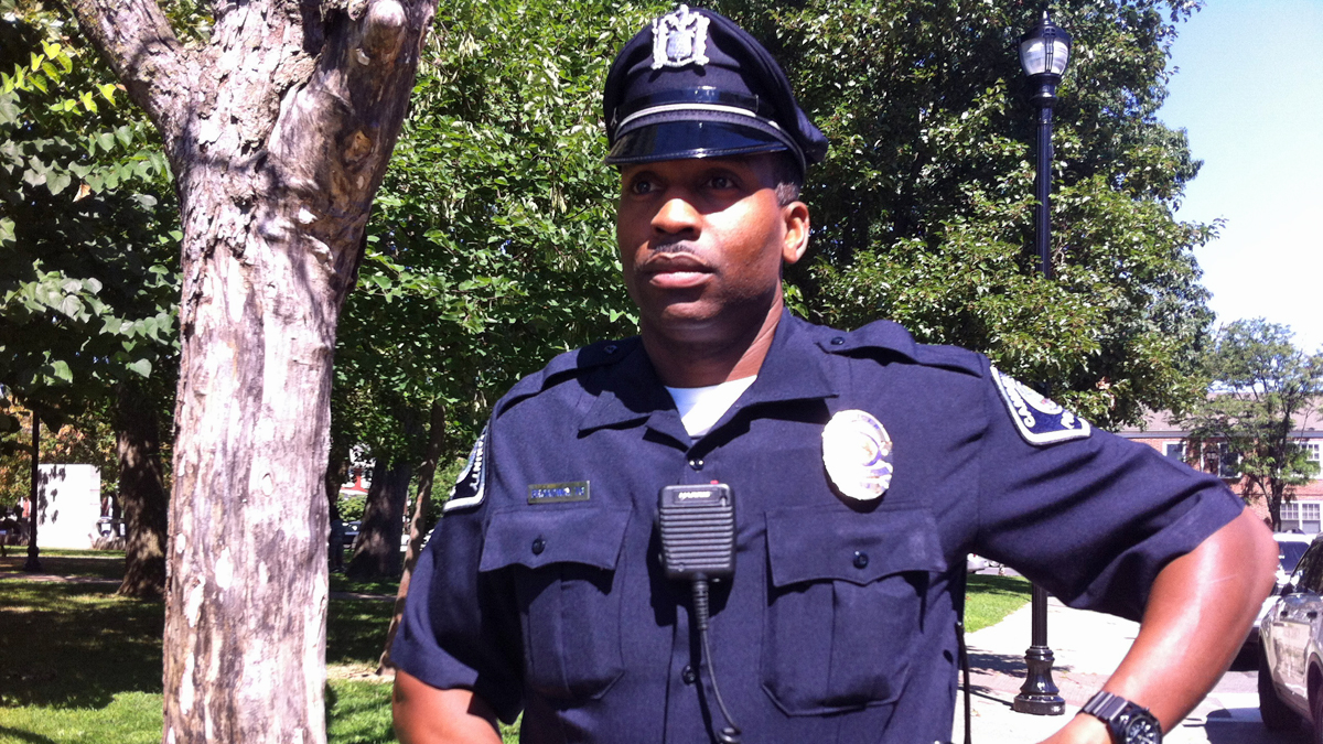 A Camden County police officer stops for a photo. He's one of those earning praise from Police Chief Scott Thomson for  professionalism over the past two years, particularly while responding to calls for a person with a gun. (NewsWorks file photo)  