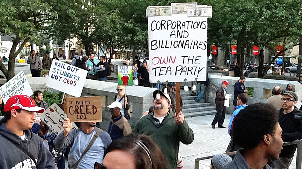 Protesters march on City Hall during the Occupy Protests (NewsWorks file photo)