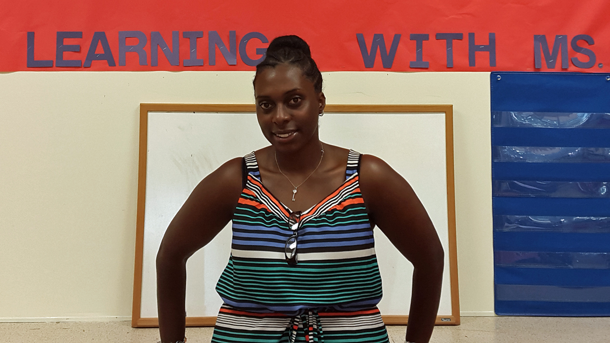  Special education teacher Dariah Jackson stands in front of a bulletin board in her room at Stetser Elementary School.(Laura Benshoff/WHYY) 