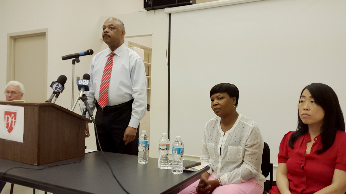  From left, Ron Whitehorne of PCAPS, PFT president Jerry Jordan, Lingelbach Elementary parent Sabrina Jones and City Council candidate Helen Gym appear at a press conference about outsourcing. (Laura Benshoff/WHYY) 