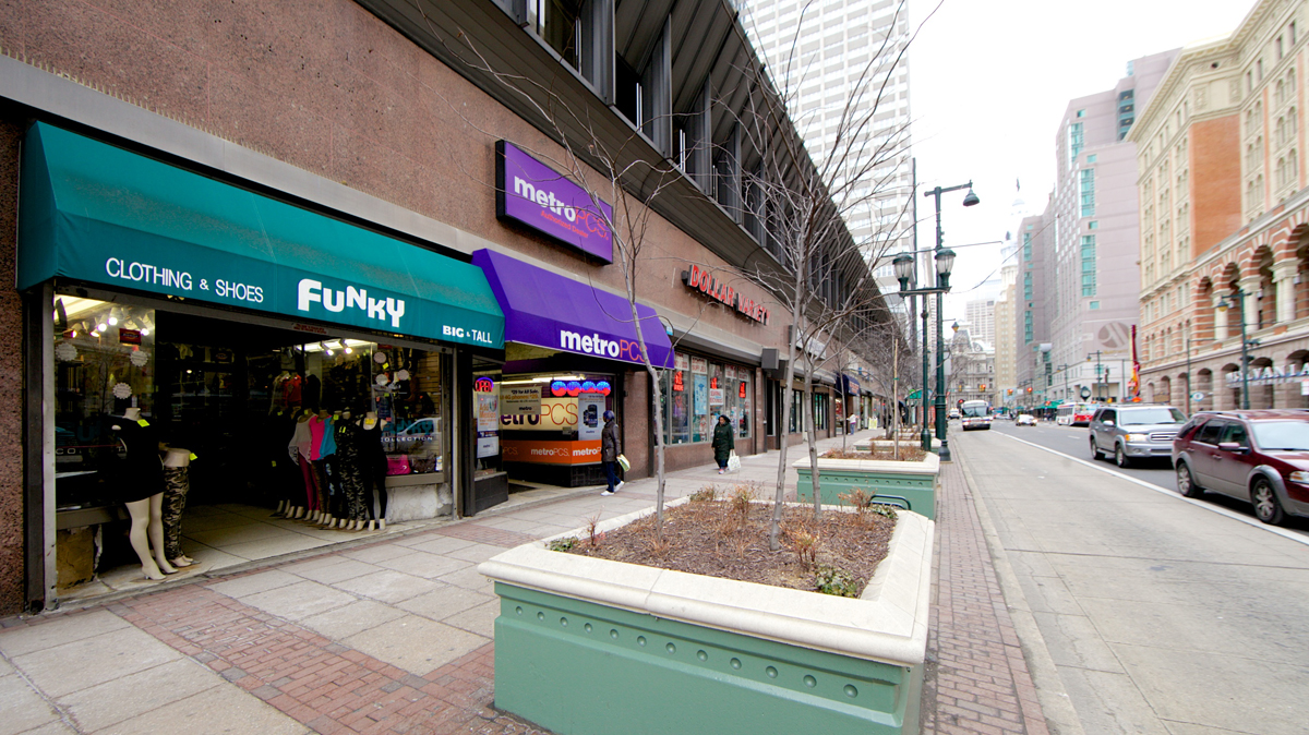  On Market Street between 11th and 12th, stores will be demolished for a $500 million-plus renovation project, making way for new street-level retail space with 325 apartments above (Nathaniel Hamilton/for NewsWorks) 