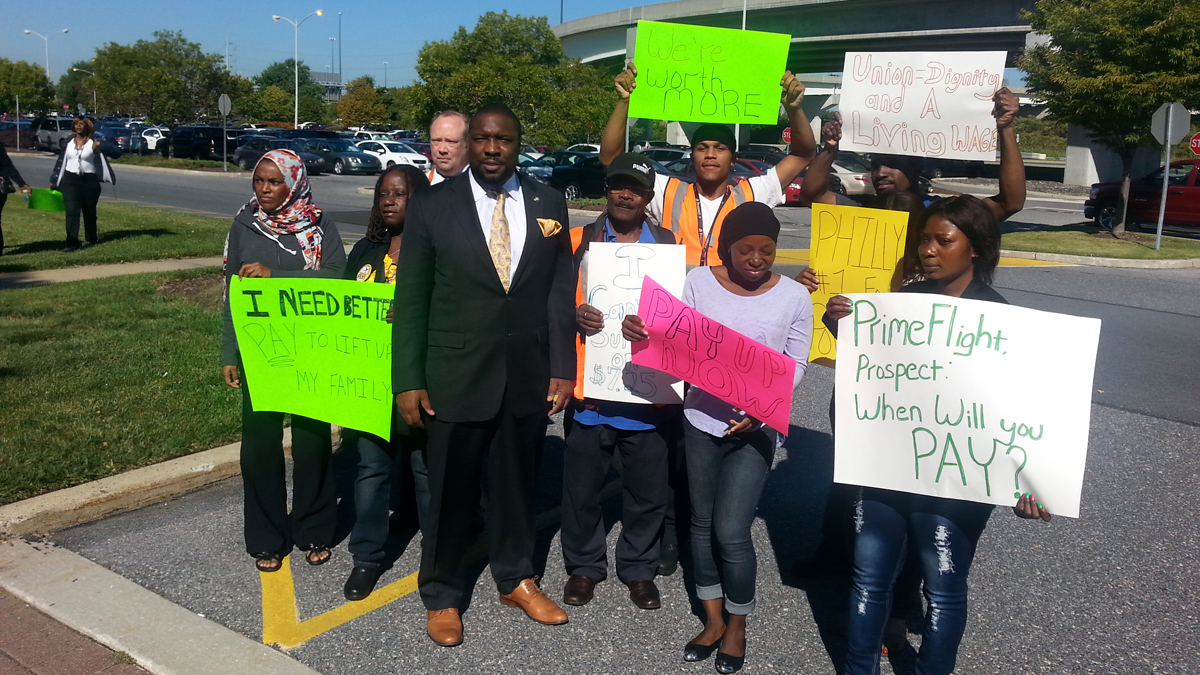  Airport workers rally for higher wages during a protest Wednesday at the Philadelphia Airport. (Tom MacDonald/WHYY) 