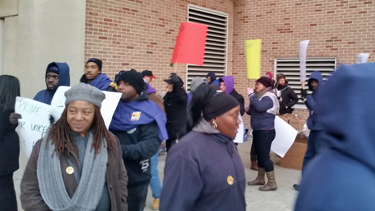  Striking Philadelphia International Airport workers walk a picket line Thursday.(Tom MacDonald/WHYY) 