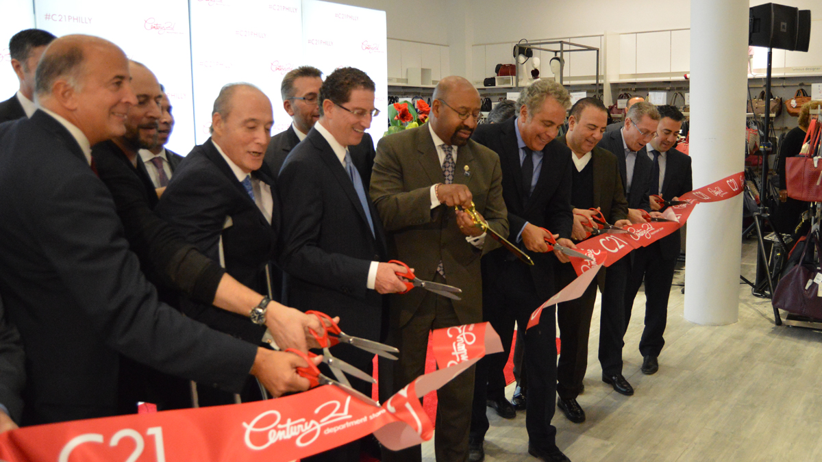  Councilman Mark Squilla, Joe Coradino Preit, Mayor Michael Nutter, And Century 21 VP Eddie Gindy cut the ceremonial ribbon to open Century 21 in Philadelphia (Tom MadcDonald/WHYY) 