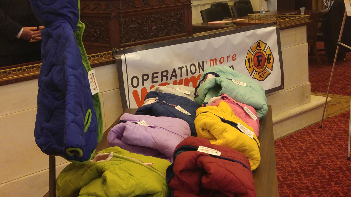  Philadelphia firefighters kick off the annual coat drive. (Tom MacDonald/WHYY) 