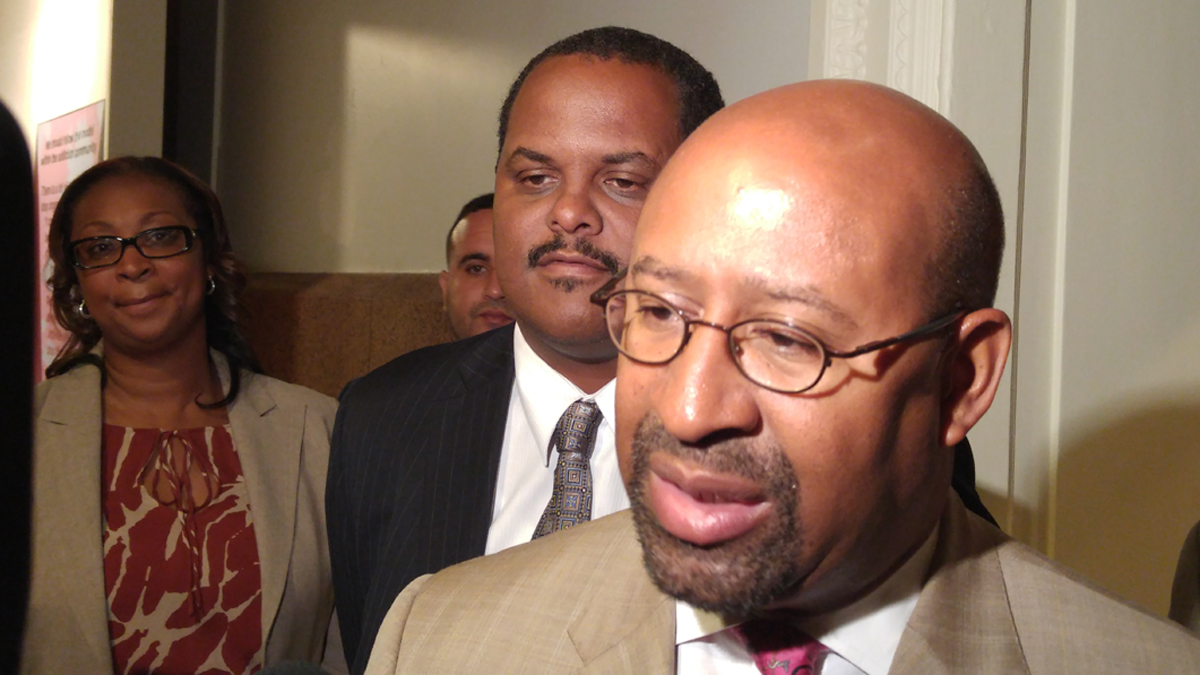  Mayor Michael Nutter and Licenses and Inspections Commissioner Carlton Williams (center) (Tom MacDonald/WHYY) 