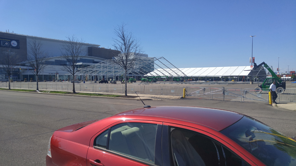 Tents are being constructed outside of the Wells Fargo Center in Philadelphia ahead of the DNC (Tom MacDonald/WHYY)