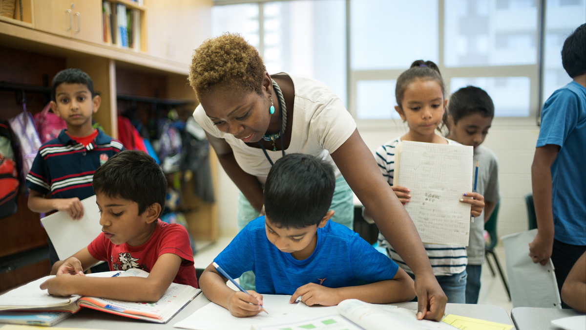  Laura Lloyd teaches third graders in class at Crescent Town Elementary School in Toronto, Ontario, Canada. (Ian Willms/For Keystone Crossroads) 