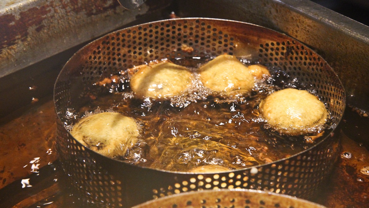 Batter-dipped Oreo cookies fry at Amish Fest at the Reading Terminal Market. (Kimberly Paynter/WHYY)