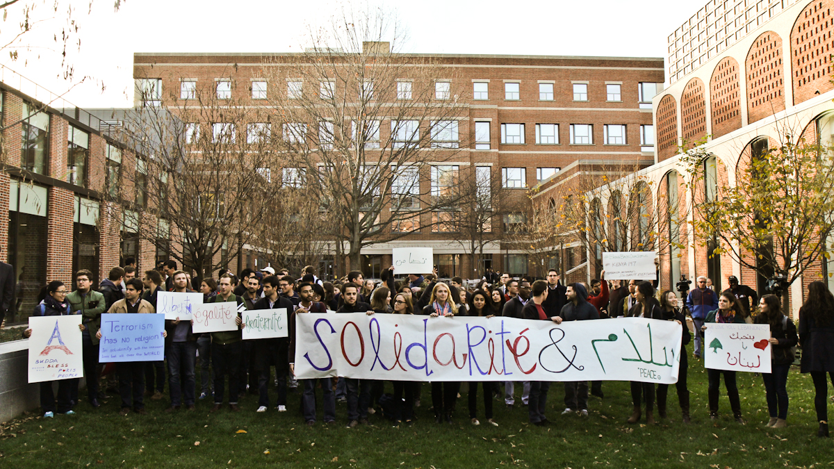 Students gather at Penn Law School’s courtyard Tuesday afternoon as a gesture of support for those affected by attacks in Paris, Beirut and Baghdad. (Kimberly Paynter/WHYY)