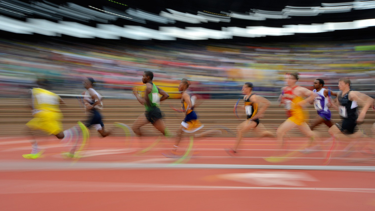  Runners race around the track at Franklin Field for the 2014 Penn Relays. (Bas Slabbers/for NewsWorks) 