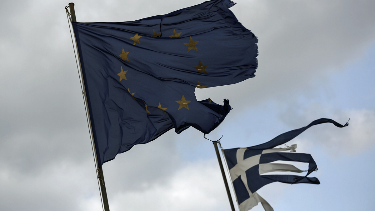  Ruined EU and Greek flags fly in tatters from a flag pole at a beach at Anavissos village, southwest of Athens, in March.  (Yorgos Karahalis/AP Photo) 
