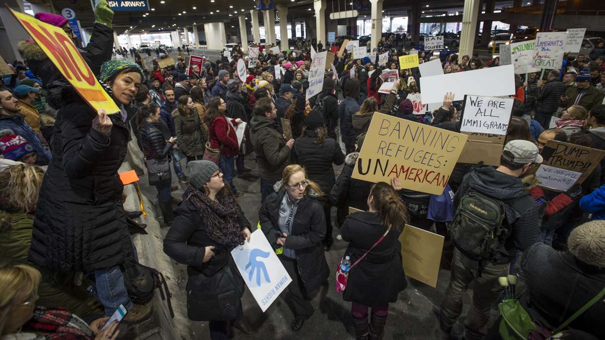 Protesters opposed to Donald Trump’s executive order on immigration march outside of Terminal A at Philadelphia International Airport. (Branden Eastwood for NewsWorks)