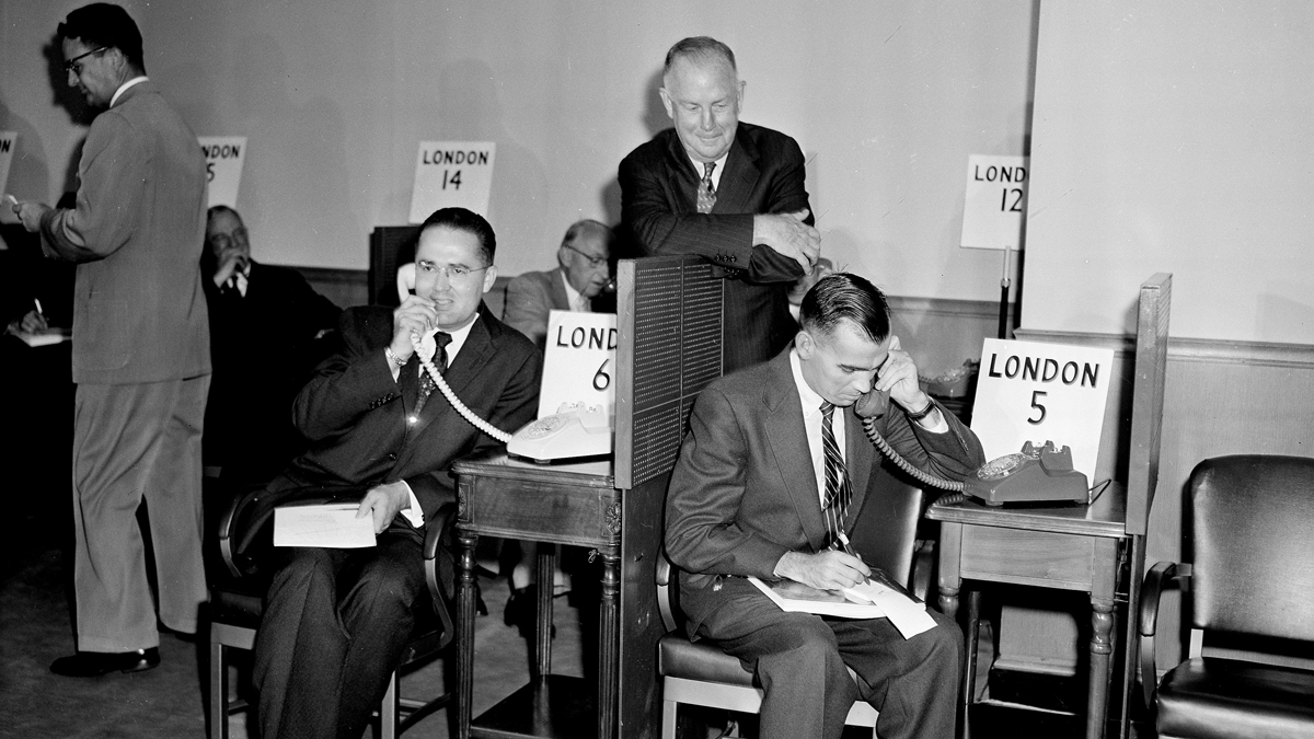 News reporters talk to London as the new 42-million-dollar transatlantic telephone cable is officially opened in New York City