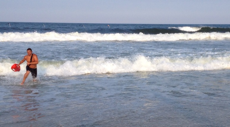  A lifeguard exiting the ocean after competing in the Seaside Park lifeguard tournament in July 2014. (Photo: Justin Auciello/JSHN) 