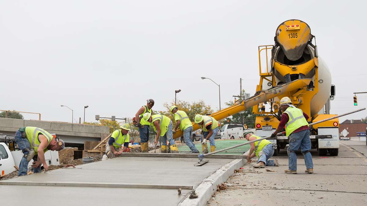  Crews work on new construction in the East Liberty neighborhood in Pittsburgh, a rapidly changing area. Early projects in such neighborhoods that may have trouble securing funding from big banks, could benefit from crowdfunding platforms like Small Change, says founder Eve Picker. (Lindsay Lazarski/WHYY)  