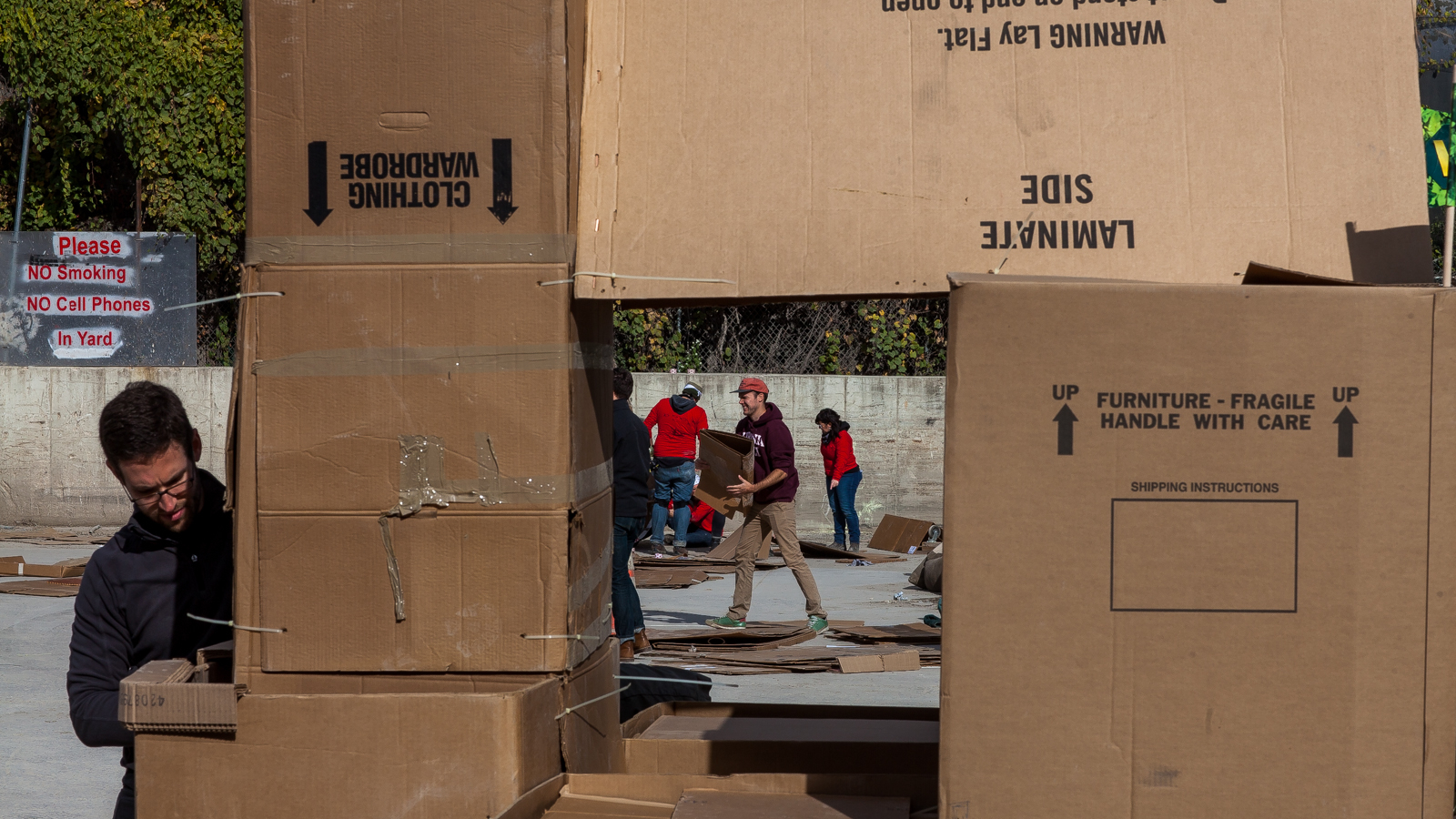 Teams work on their forts during the Please Crush Museum. (Brad Larrison/for NewsWorks)