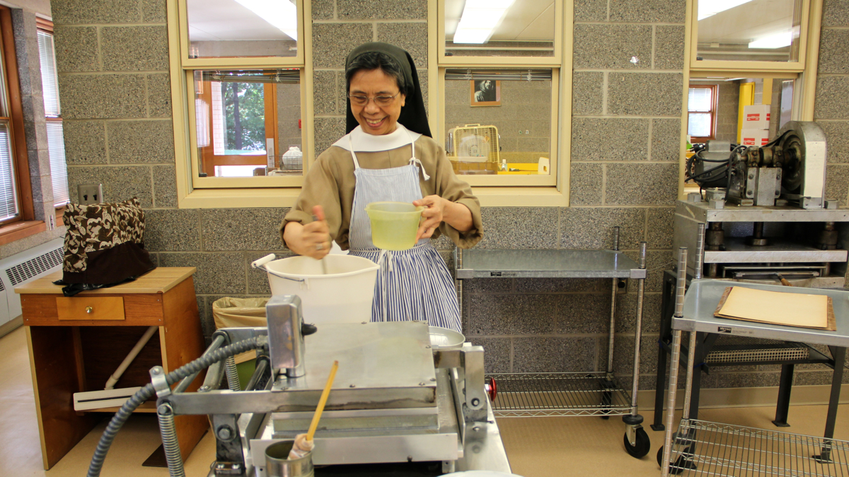  Baking altar breads is the work that breaks up days focused primarily on prayer for the sisters of the Monastery of St. Clare in Langhorne, Pa. (Emma Lee/WHYY) 