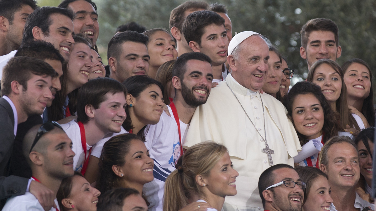  Pope Francis poses for a photo after a meeting with youths in downtown Cagliari, Italy, Sunday, Sept. 22, 2013. Francis denounced what he called big business's idolatry of money over man as he traveled Sunday to one of Italy's poorest regions to offer hope to the unemployed and entrepreneurs struggling to hang on. (AP Photo/Alessandra Tarantino) 