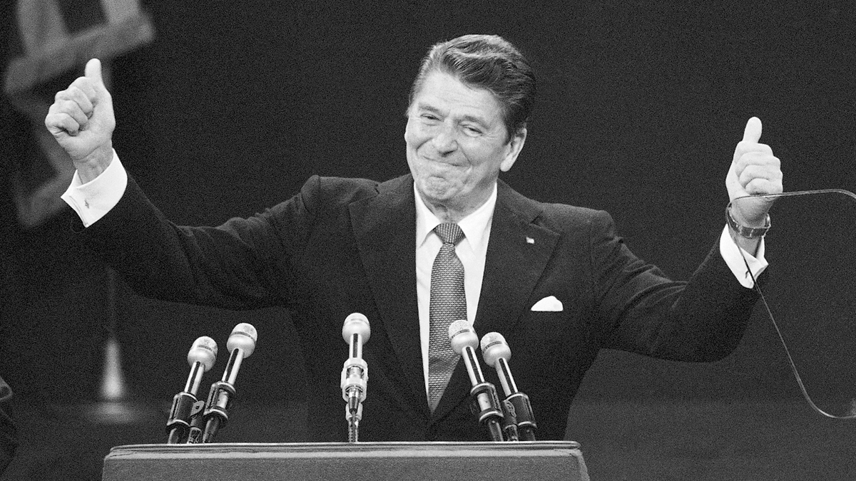  Republican presidential candidate Ronald Reagan is shown standing before a cheering Republican National Convention in Detroit in 1980. (AP Photo/Rusty Kennedy, File) 
