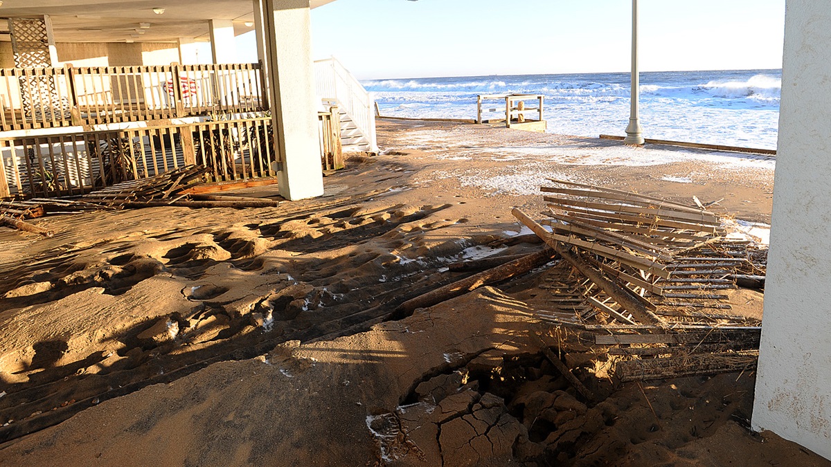  Sunday morning January 24th high tide at Rehoboth Beach showed a massive loss of the dune line, severe beach erosion along with boardwalk damage on the north end near the Henlopen Hotel. Crews were out cleaning up also as the tide though not as high as yesterday, still came up the beach. (Chuck Snyder/for NewsWorks) 
