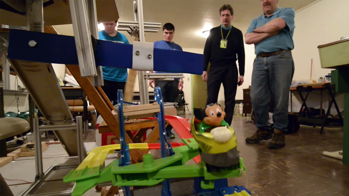  Students and instructors from the winning team at Father Judge High School in Philadelphia look on while testing their device. (Bas Slabbers/for NewsWorks) 