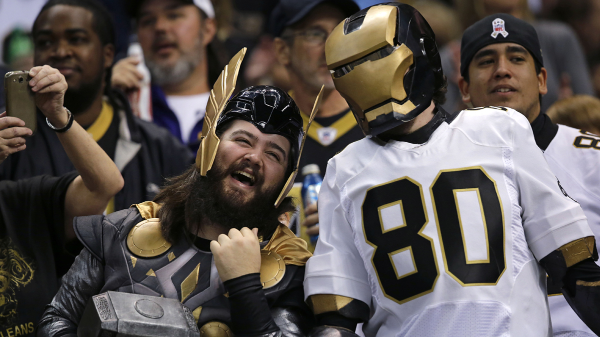  New Orleans Saints fans cheer in the first half of an NFL football game, Sunday, Dec. 29, 2013. Philadelphia police say a few officers may dress as Saints fans to keep the peace during the Eagles playoff game Saturday night.  (AP Photo/Bill Feig) 